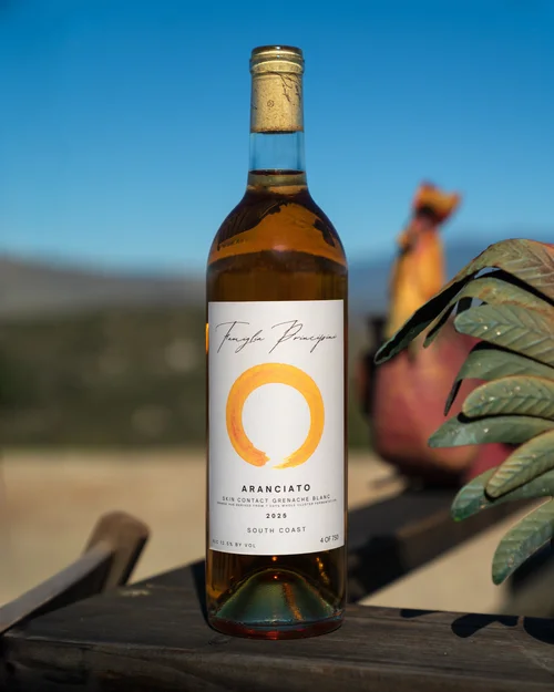 Famiglia Principini Aranciato — orange enso circle label on amber bottle, South Coast California 2025